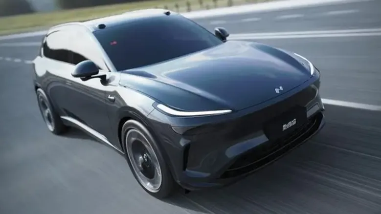 NIO's Onvo L80 camouflaged test vehicle seen charging at Tesla supercharger